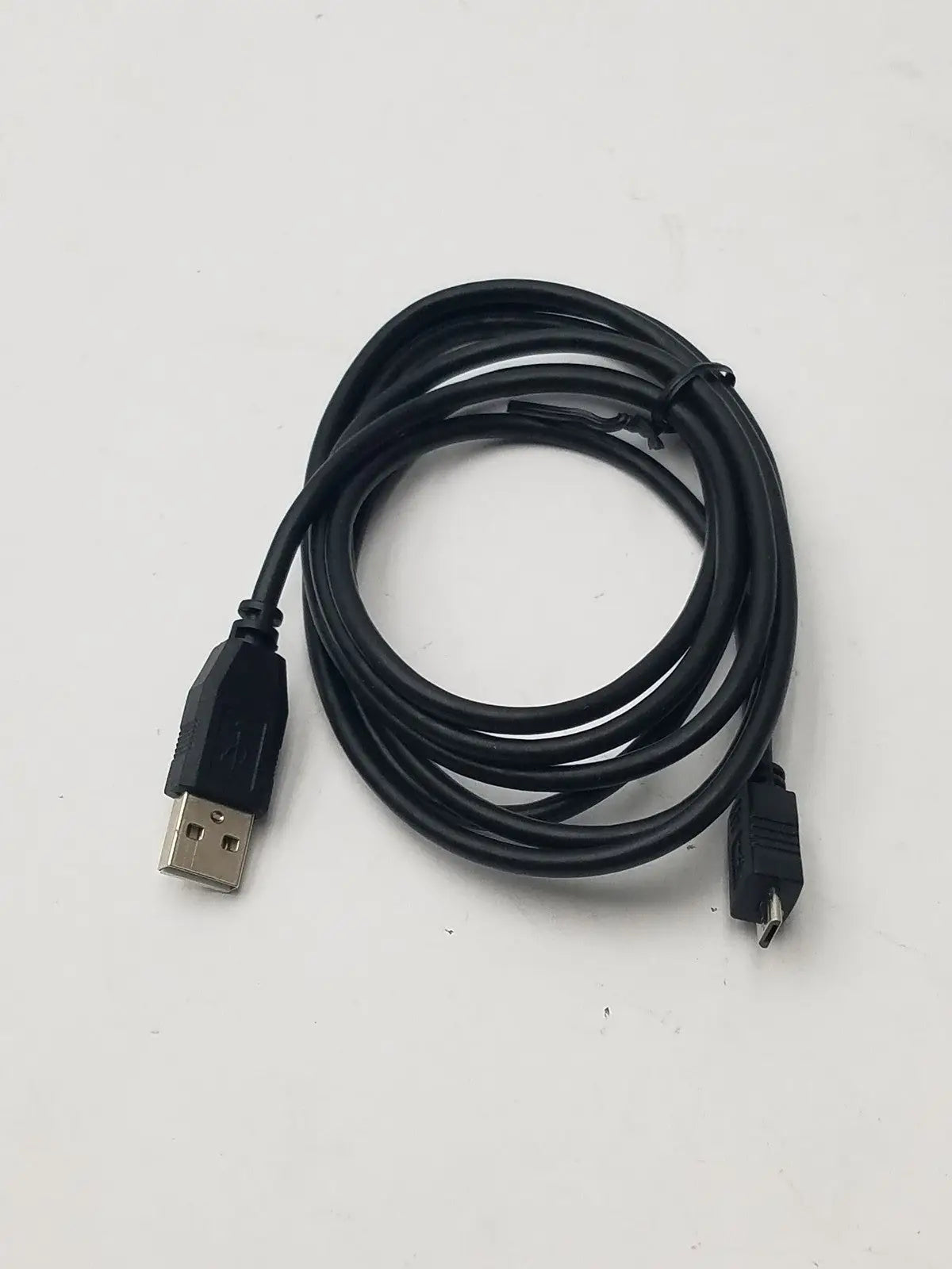 Black usb a to mini 5 pin b data charging cable cord adapter coiled neatly with simple plastic sheath for charging use