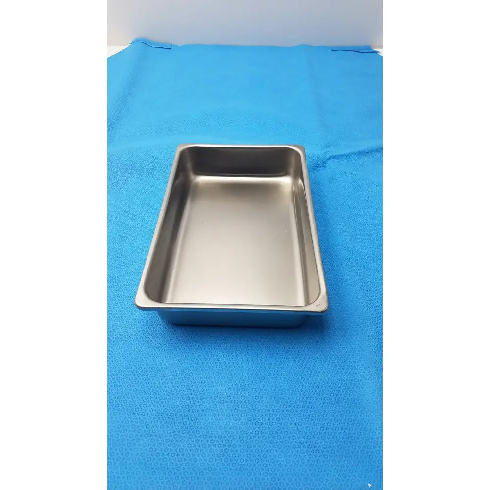 Rectangular stainless steel 10 inch deep steam table food pan with rounded corners and shallow reflective interior