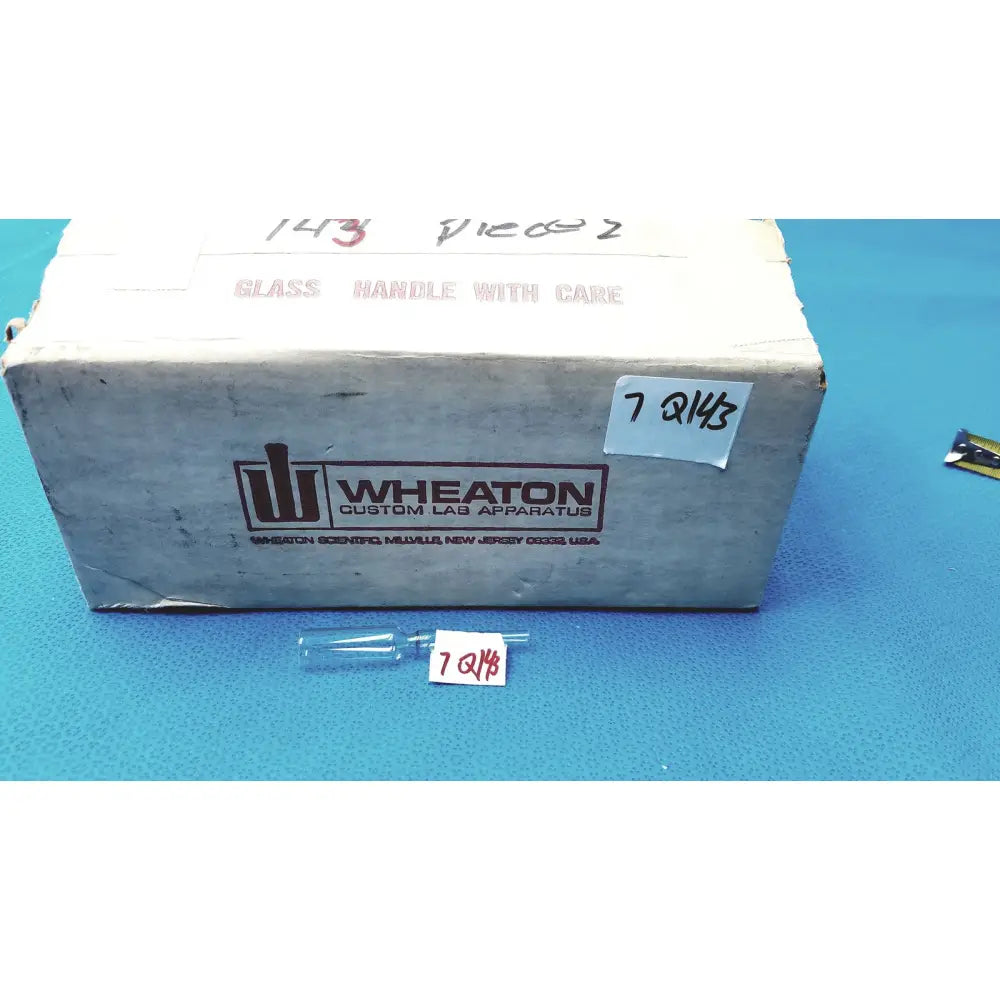 1ml clear glass ampoule made of low borosilicate with a narrow neck and rounded body labeled 7 q143
