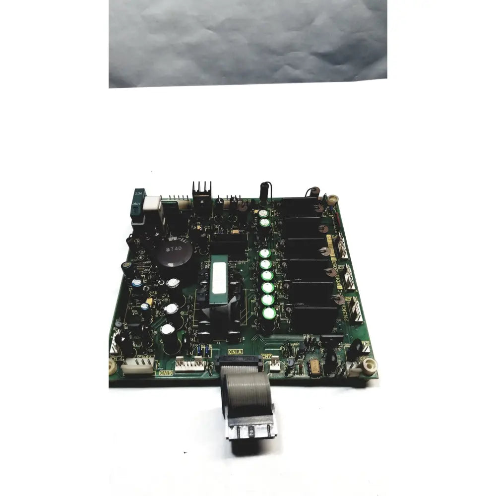 Green printed circuit board with black components white capacitors and a coiled gray cable on 2p8414t mother board