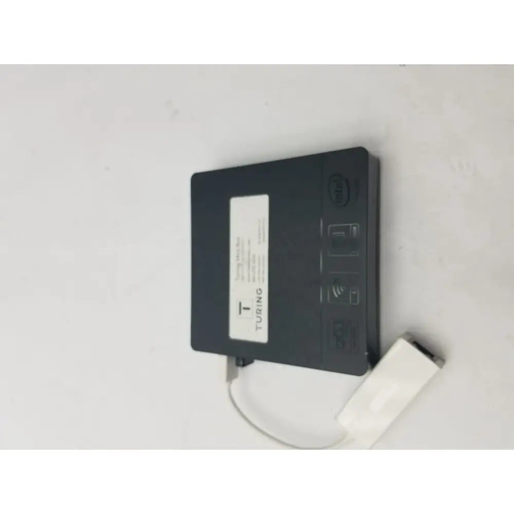 Black turing branded wireless network adapter with white usb cable attached to a 3 pin female connector cable