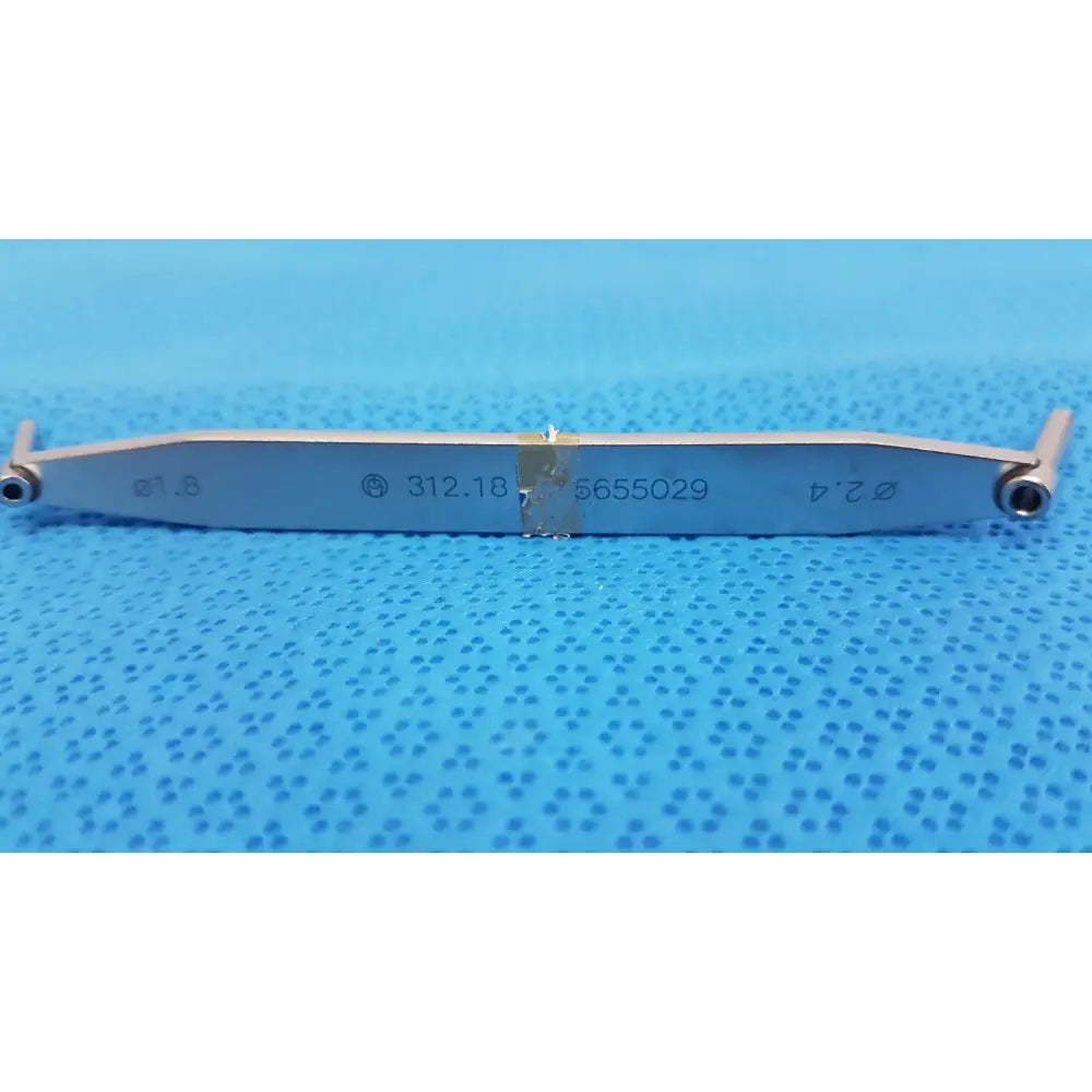 Silver metal 312.18 drill depth gauge with engraved markings and pivoting arms for surgical orthopedic use