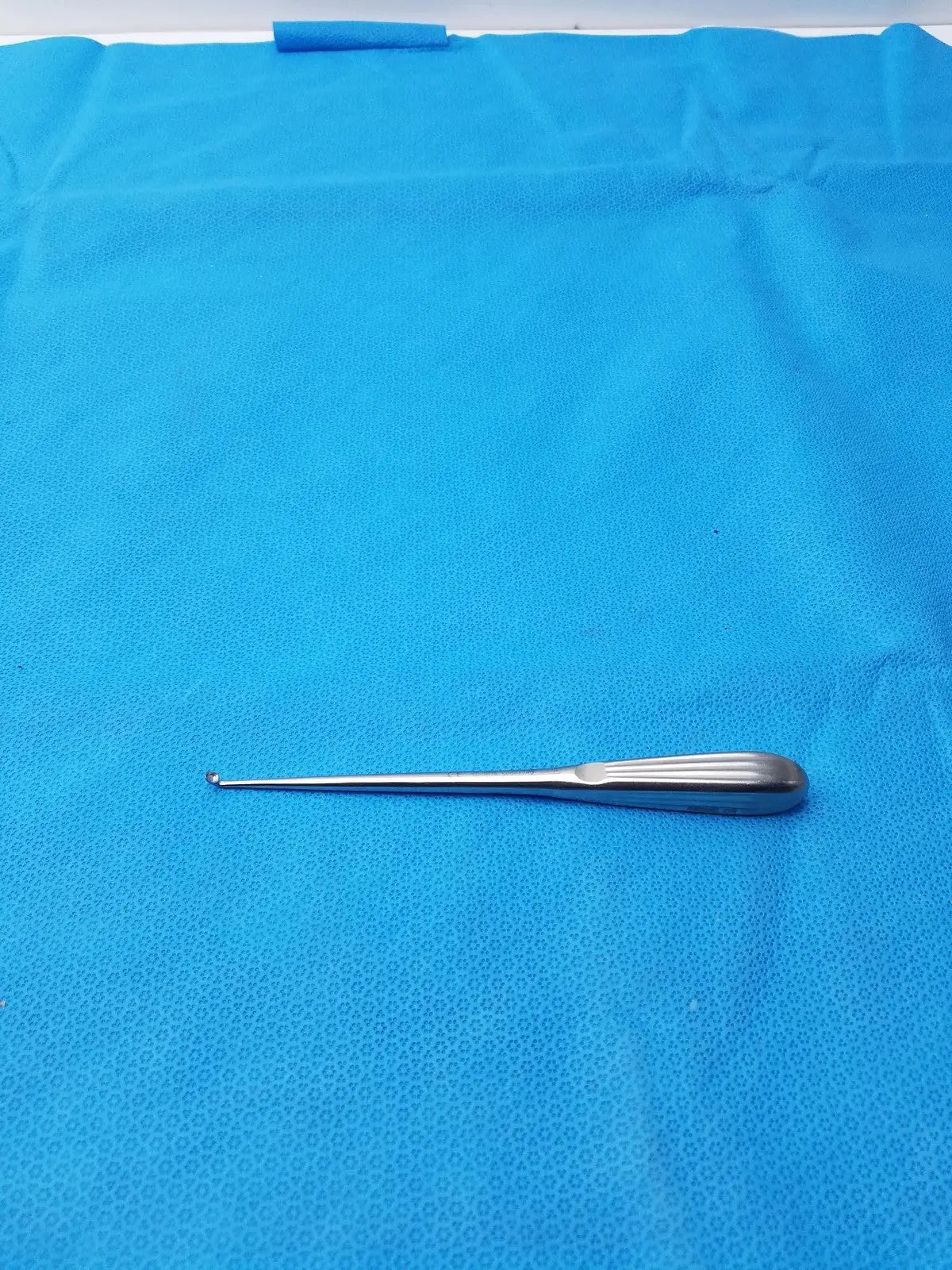 Silver spratt bone curette stainless surgical orthopedic instrument with long slender shaft and curved tip