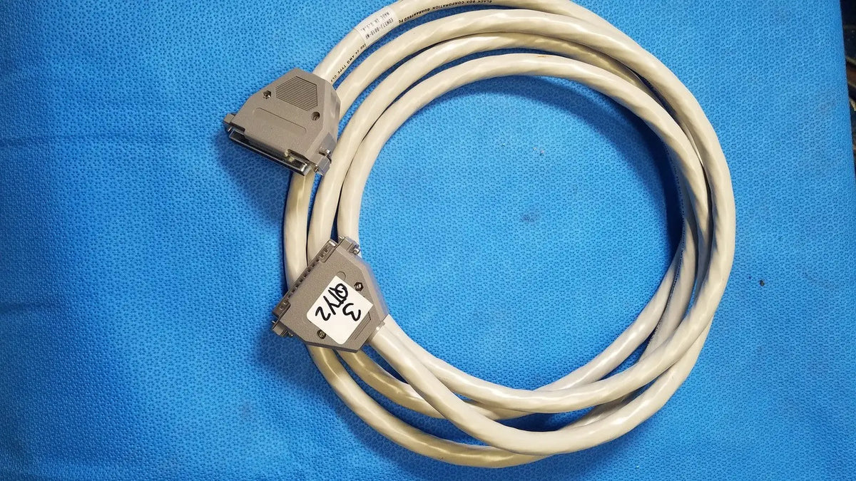Beige coiled 37 male to 37 female pin connector data cable with gray plastic connectors and labeled 3 2/16 female pin connector