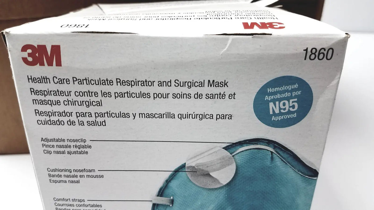 White 3M 1860 particulate respirator and surgical mask box featuring blue mask illustration with adjustable noseclip and foam
