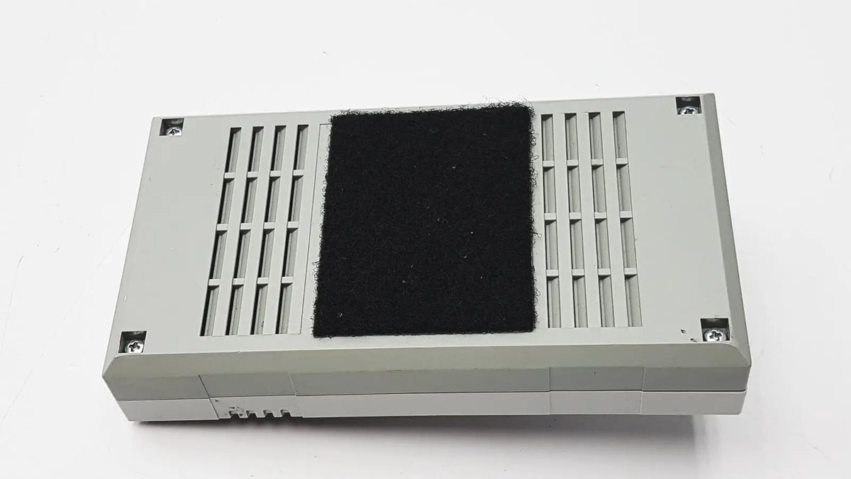 Gray rectangular 3M 60923 half mask respirator with black felt pad and vertical slotted vents for enhanced filtration