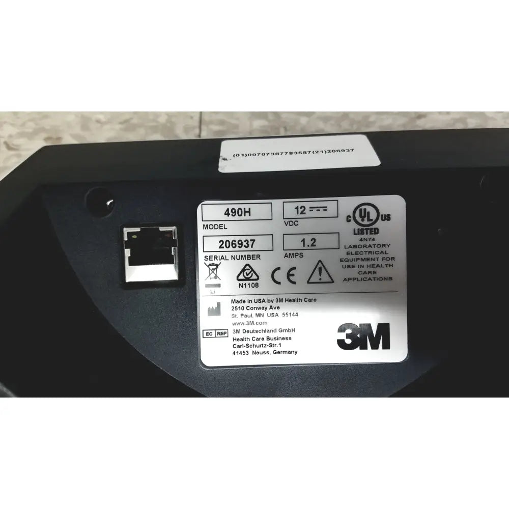 Black 3m attest auto-reader 490h incubator showing electrical equipment with silver label of specifications and certification marks