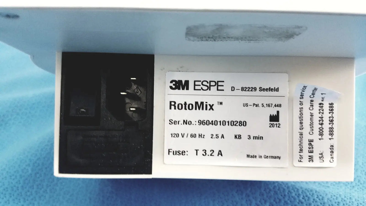 White plastic 3m espe rotomix capsule mixing unit 120v with black electrical connector and serial number label visible