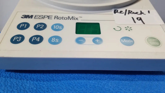 White and blue 3m espe rotomix rotating mixing device with digital display and program buttons for dental use