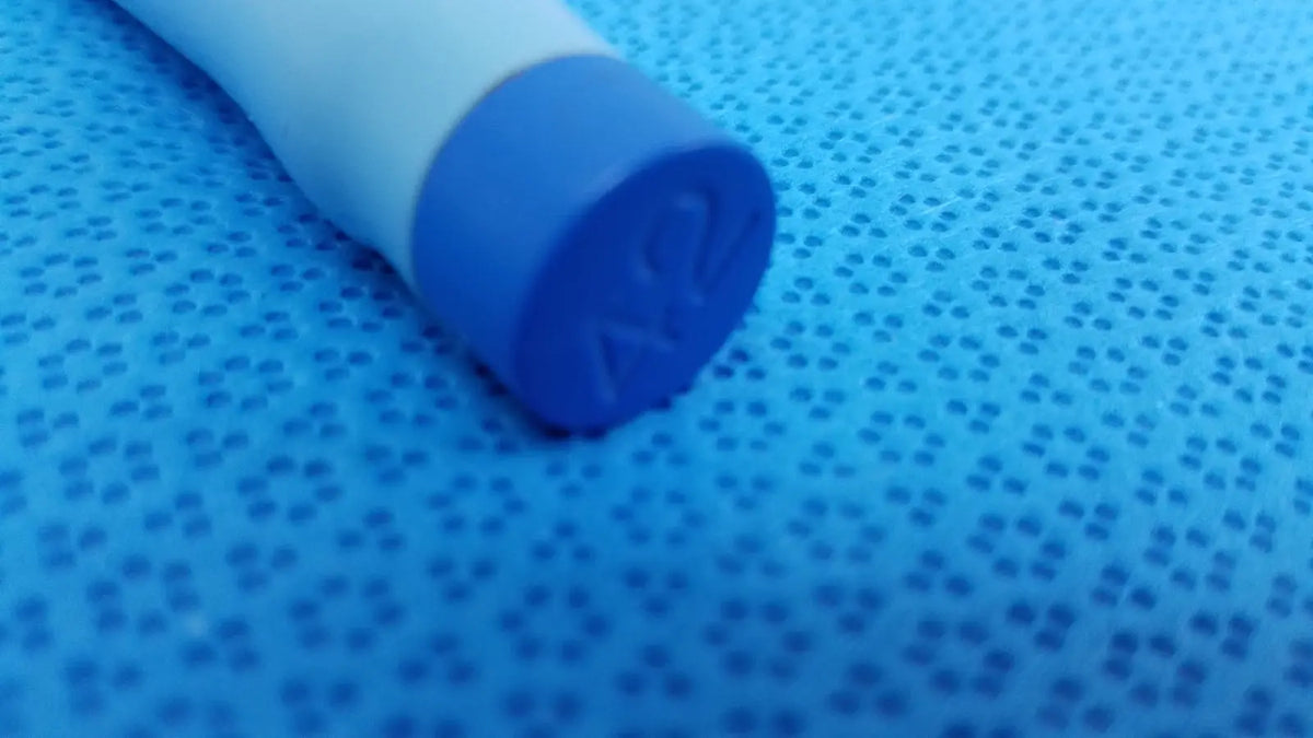 Blue and white maloney tapered tungsten-filled esophageal bougie 42fr with textured grip for precise insertion