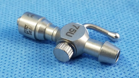 Silver 75u universal stopcock with textured knob and engraved markings for fluid management in urology and laparoscopy
