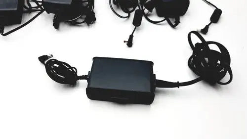 Black rectangular ac adapter aa24750l-001 with coiled cables for respironics astec series respiratory devices