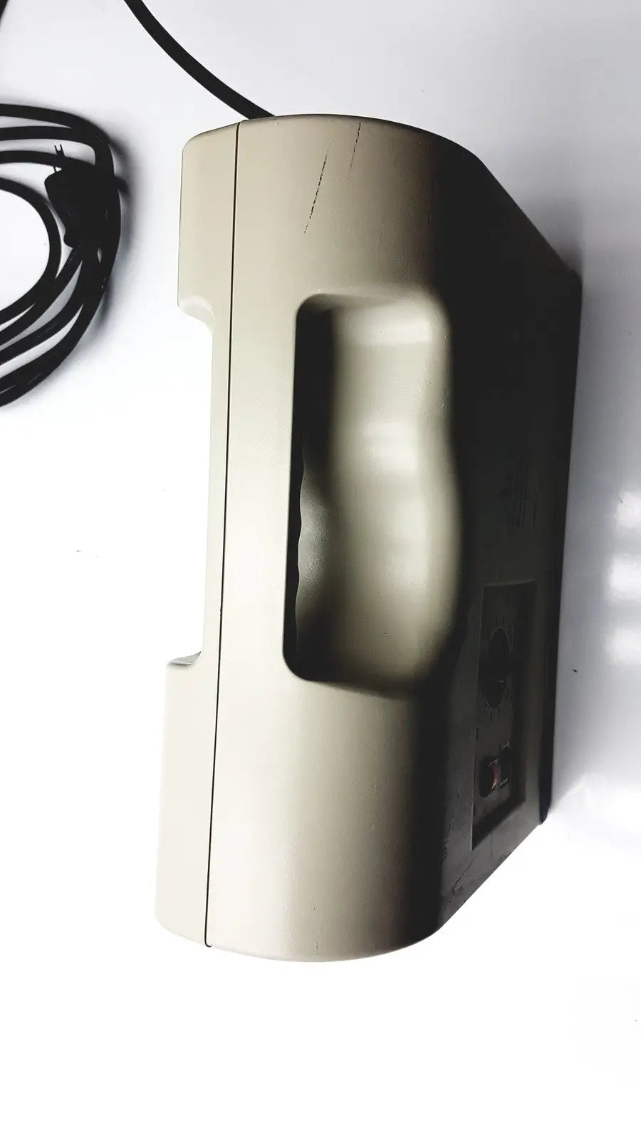 Beige plastic telephone with molded hand grip and black cord as control unit for accumax quantum convertible pressure redistribution system