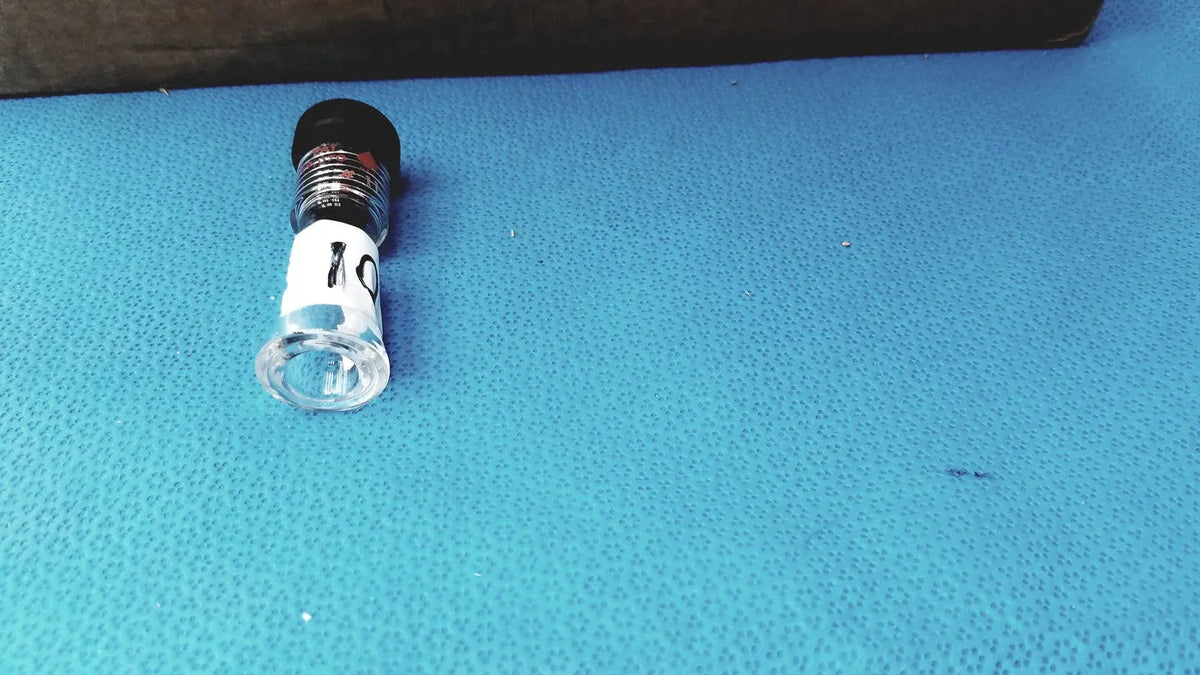 Clear glass vial with black cap and white label 10 used as an inlet adapter midi for ace glass ace-thred straight connecting inlet