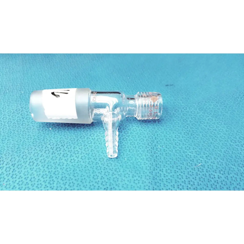 Clear glass lab glass fitting thermometer adapter with frosted white cap and threaded connections for lab use