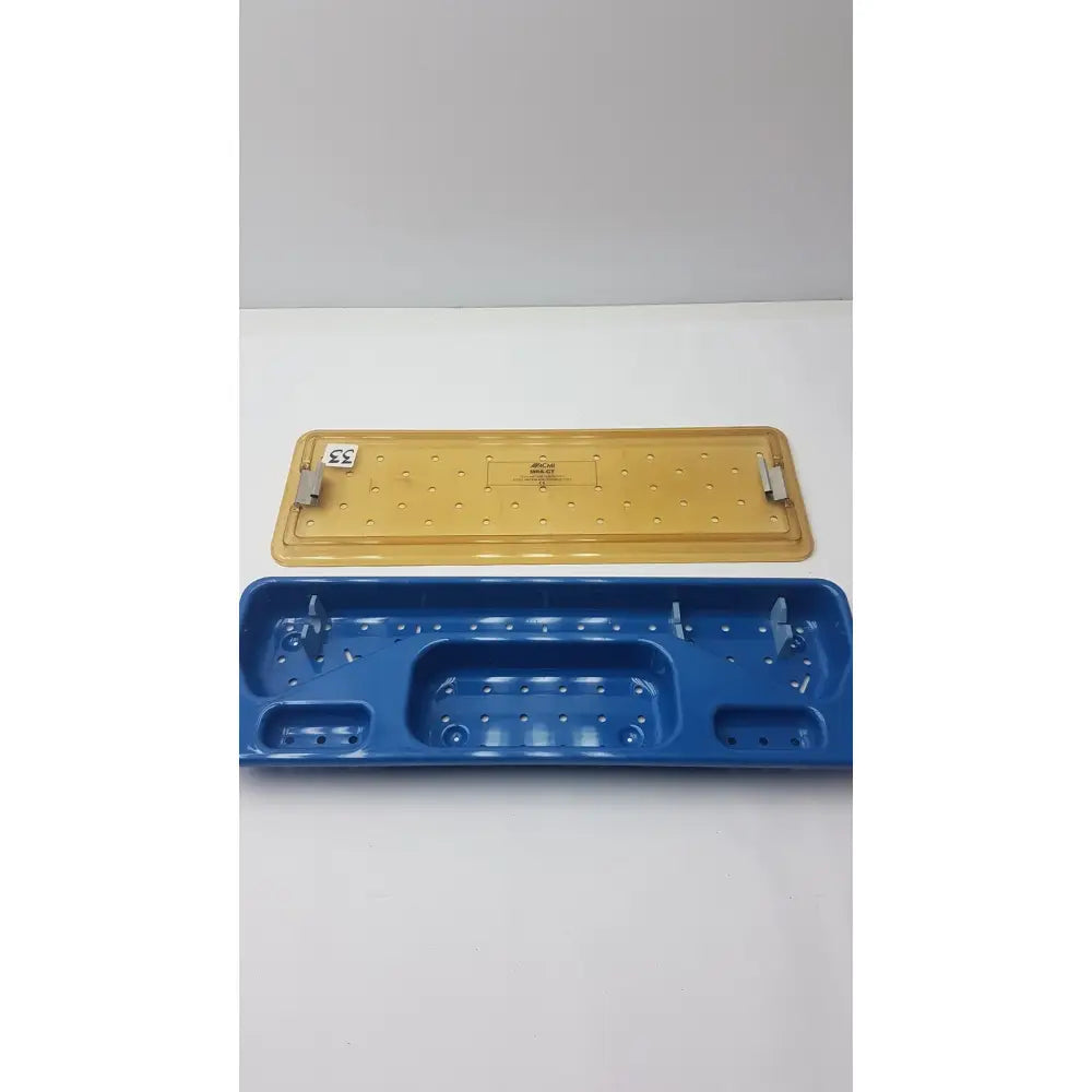 Blue and yellow plastic acmi mra-gt slimline sterilization and storage tray designed for surgical instrument organization