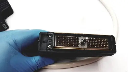 Black rectangular printer cartridge with metallic contacts and central adjustment knob for acuson l382 3.5 mhz linear array ultrasound transducer
