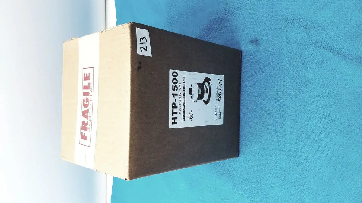 Brown cardboard box labeled htp-1500 with fragile tape containing adroit heat therapy pump for heat therapy use