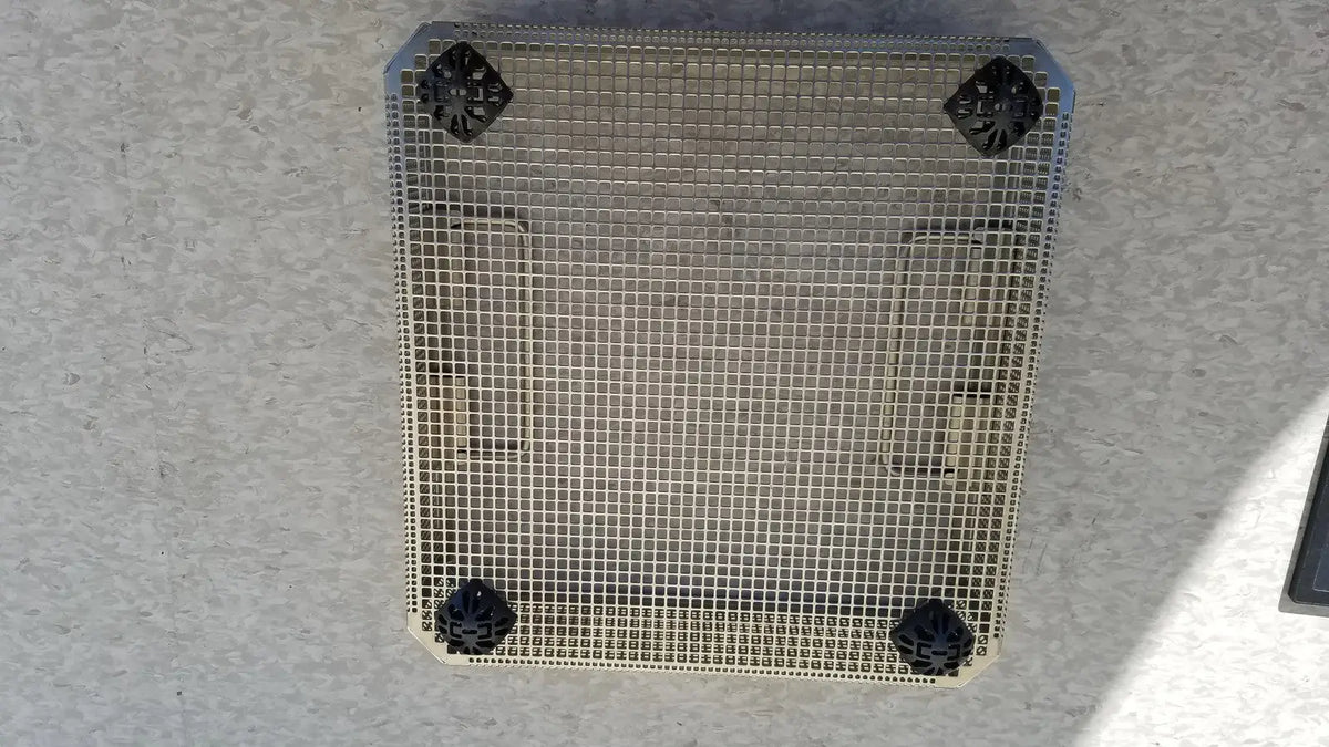 Square metal mesh grate with black plastic corner caps of aesculap jf113r stainless steel instrument sterilization basket tray