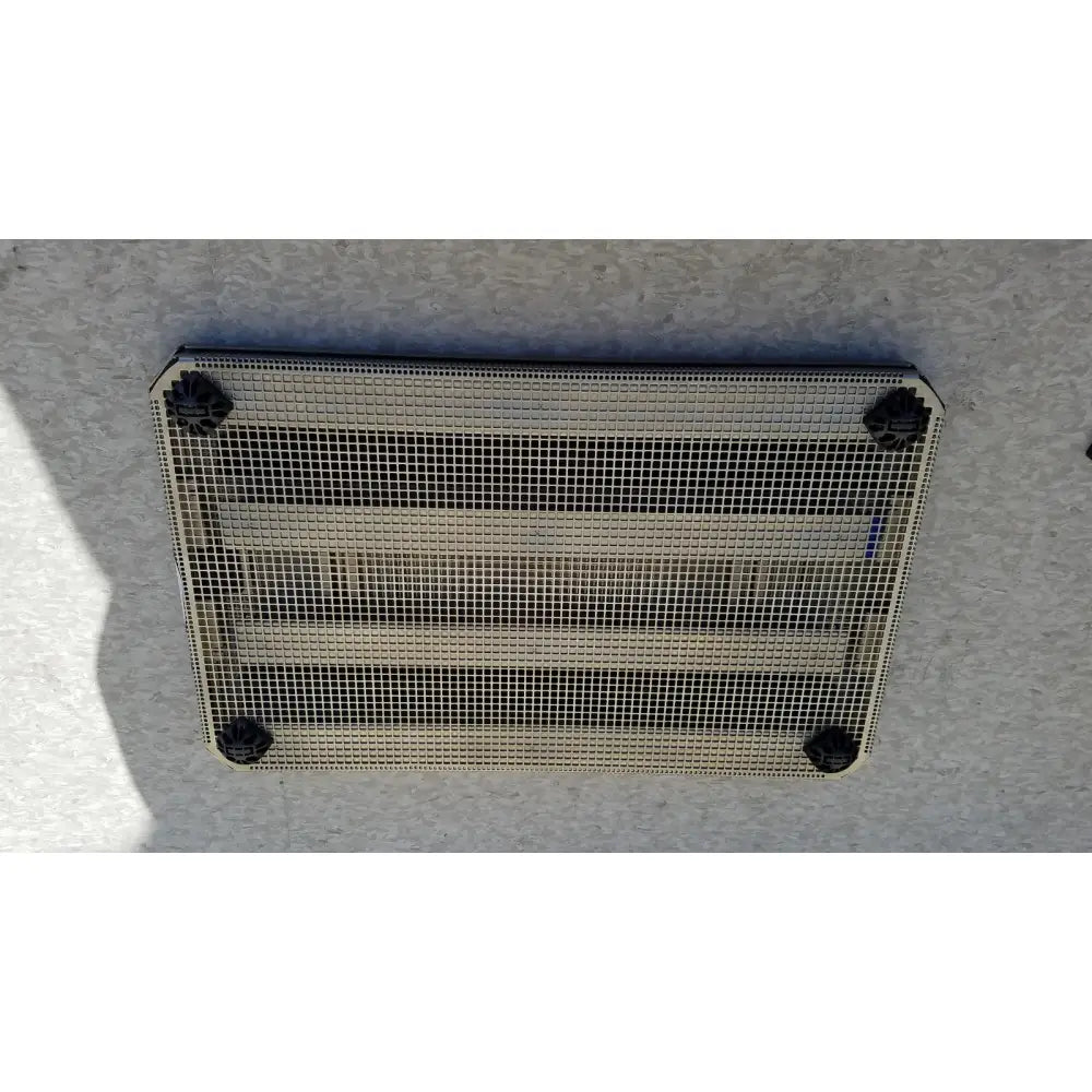 Rectangular metal mesh vent with black plastic corner caps for aesculap jf257r sterilization case tray pn2089a modified