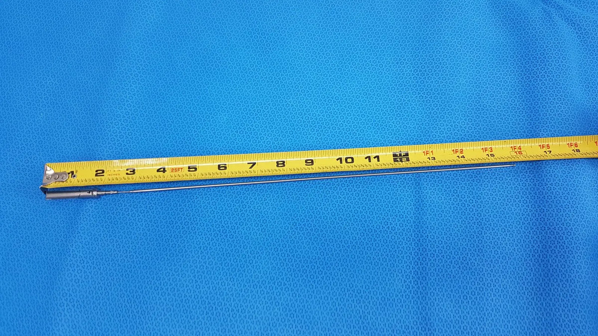 A yellow measuring tape with black markings and metal end on blue surface for aesculap laparoscopic grasper model p0623r