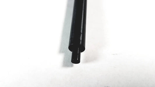 Black cylindrical aesculap pm975r insulated outer tube converter with hollow center and smooth matte finish for surgical use