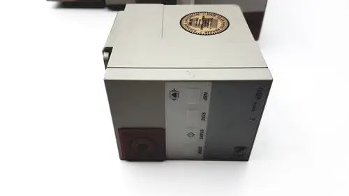 Gray rectangular agilent hp philips m1008b nbp patient monitor module with gold emblem and side labels visible
