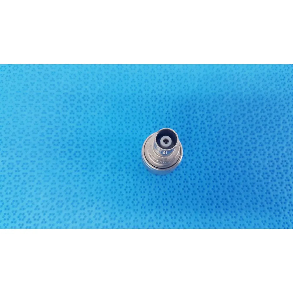 Silver-colored metal Agilent N-Type female to BNC male coaxial adapter with threaded exterior and black rubber seal