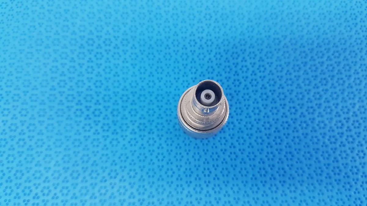 Silver-colored metal Agilent N-Type female to BNC male coaxial adapter with threaded exterior and black rubber seal