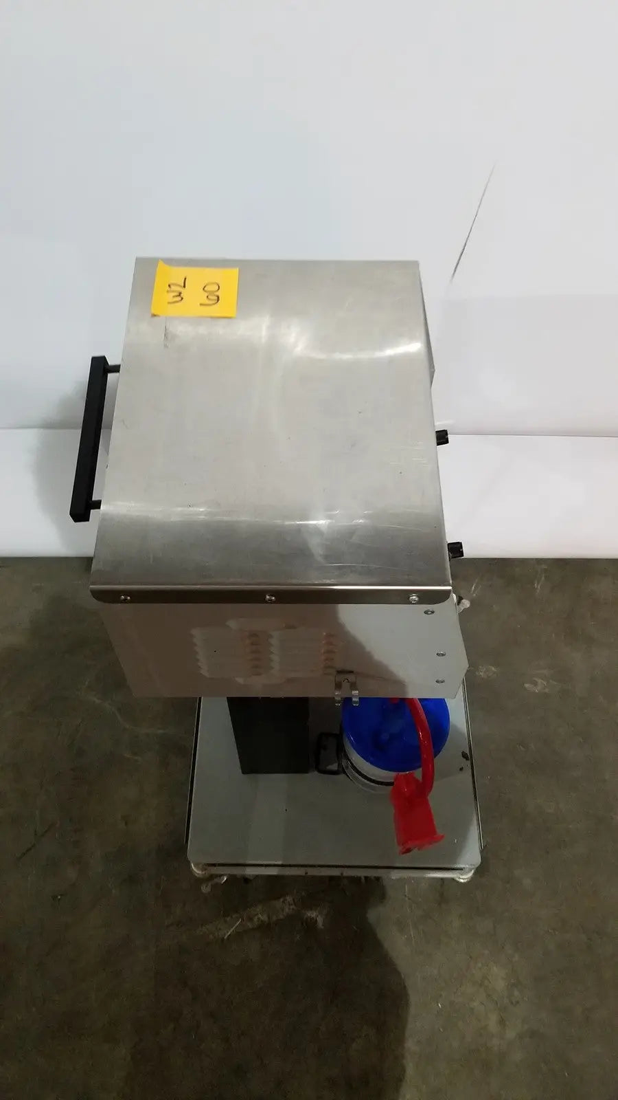 Stainless steel allied healthcare gomco model 6037 industrial food processor with black handle and blue container attached
