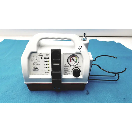 White plastic allied healthcare gomco optivac g180 portable aspirator with black accents and pressure gauge