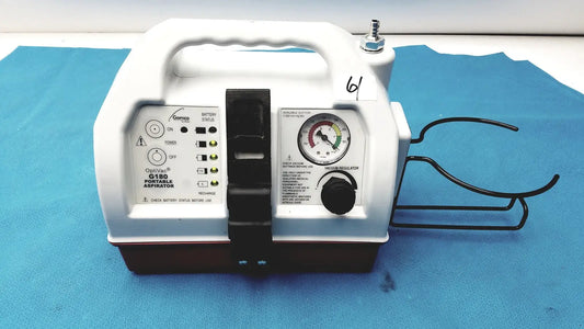 White plastic allied healthcare gomco optivac g180 portable aspirator with black accents and pressure gauge