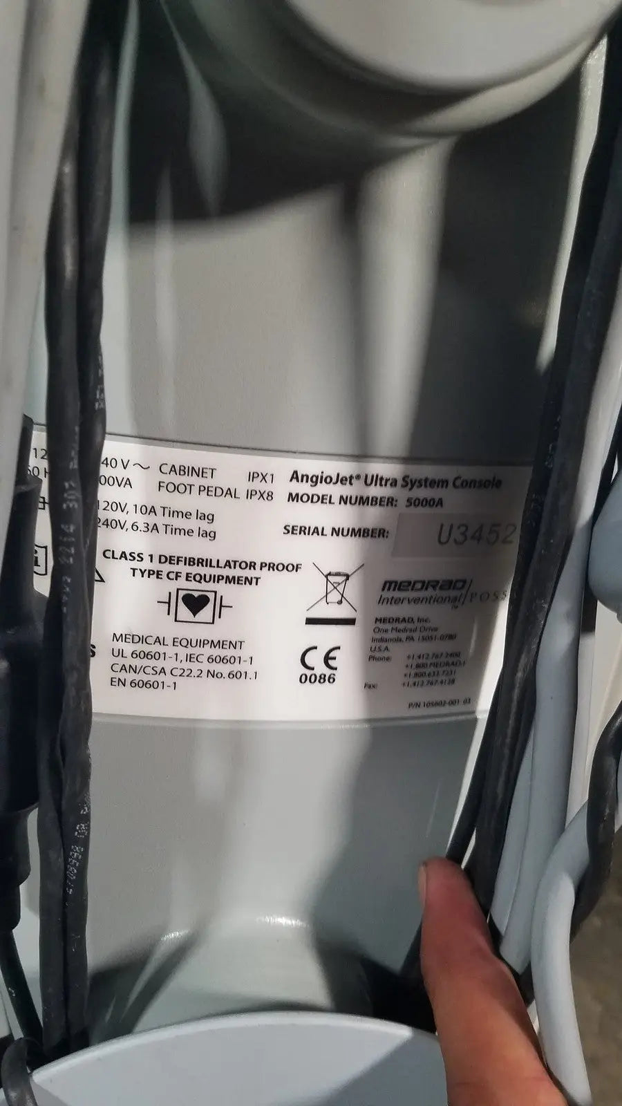 Gray metallic angiojet ultra thrombectomy system console reuse medical device with model number and certification labels