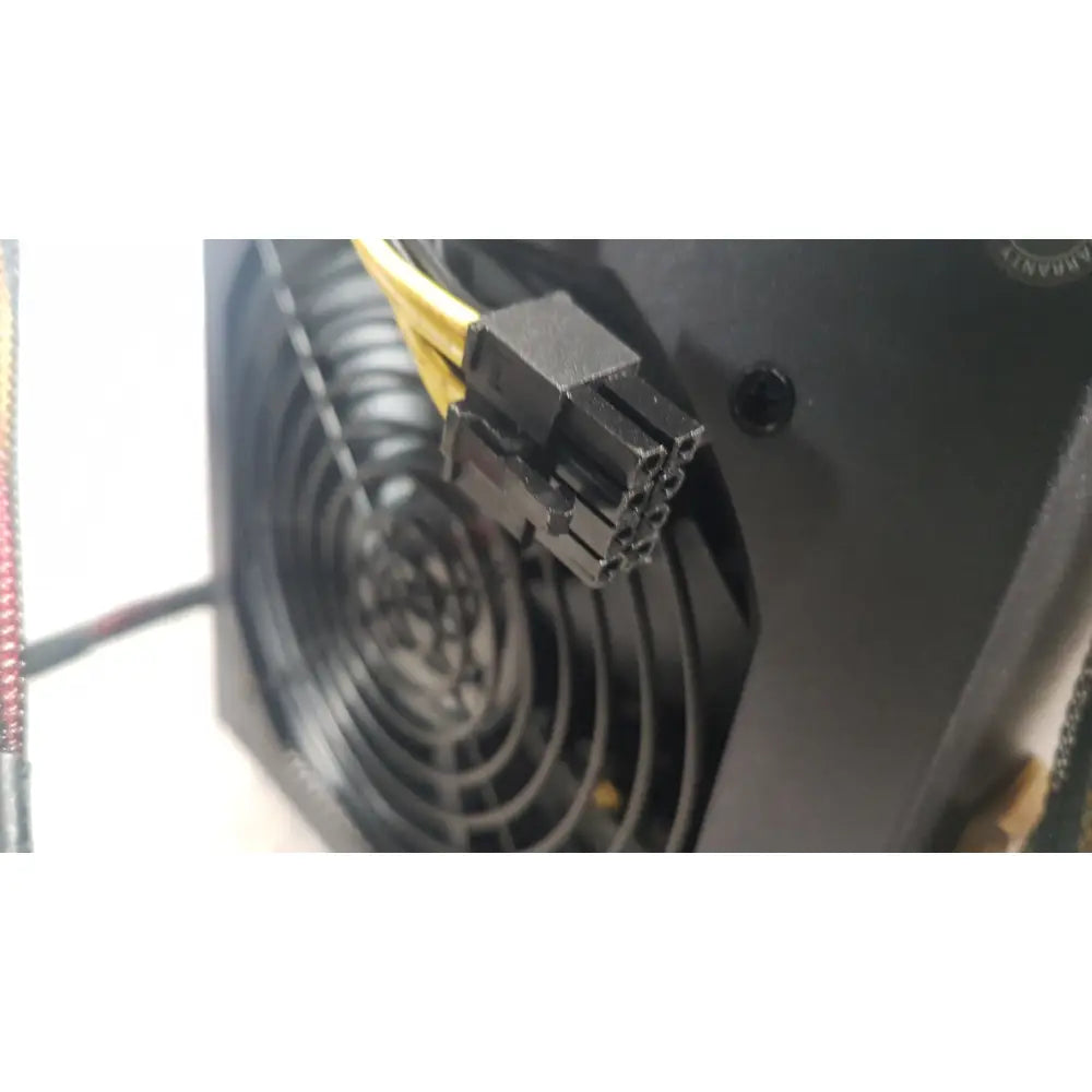 Black plastic 8-pin power connector with yellow cables on the back of the antec truepower 550w black switching power supply