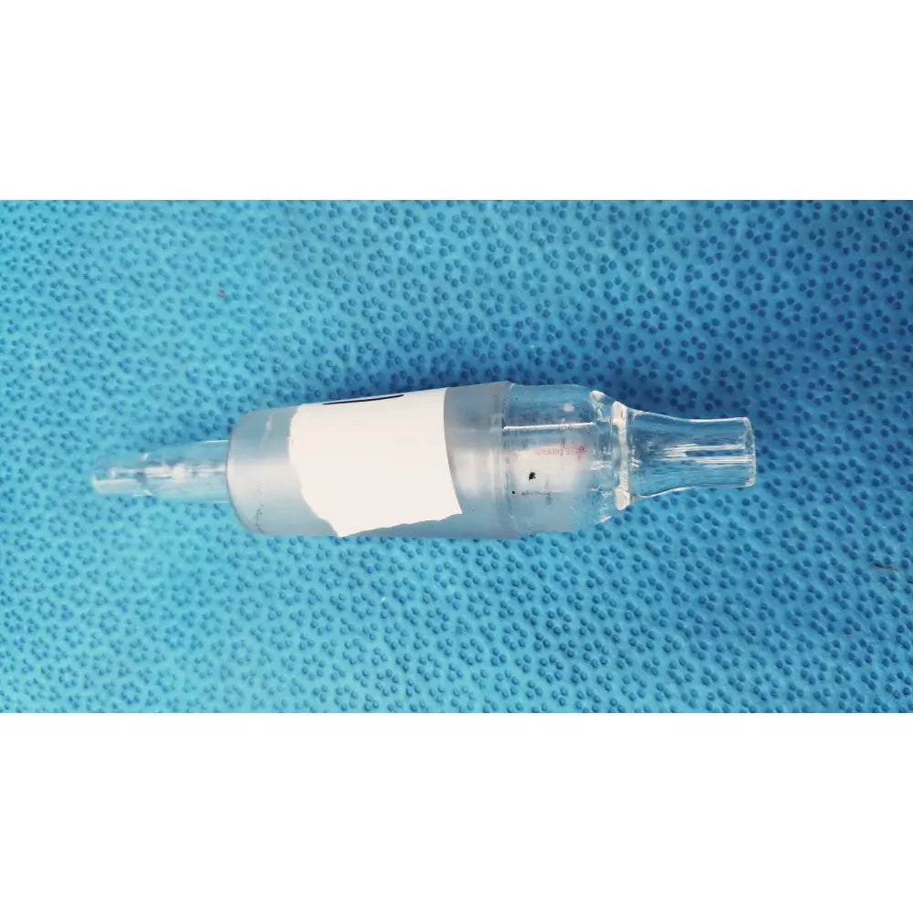 Clear glass aquarium air pump control valve with white label wrapped around midsection for pump control use