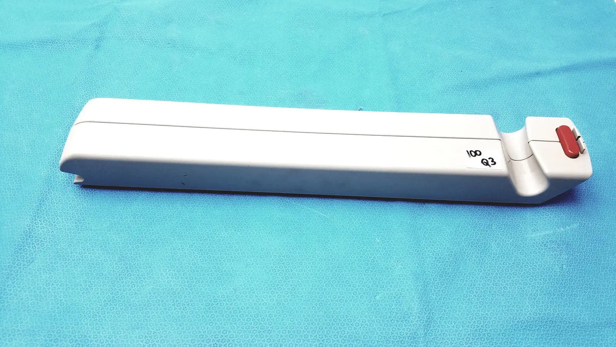 White plastic surgical instrument with red button and engraved markings for arjo huntleigh ab lead acid battery use