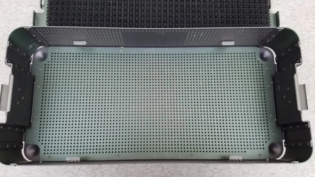 Green perforated metal sterilization tray with black reinforced corners and handles from ArthroCare AutoCuff OPUS collection