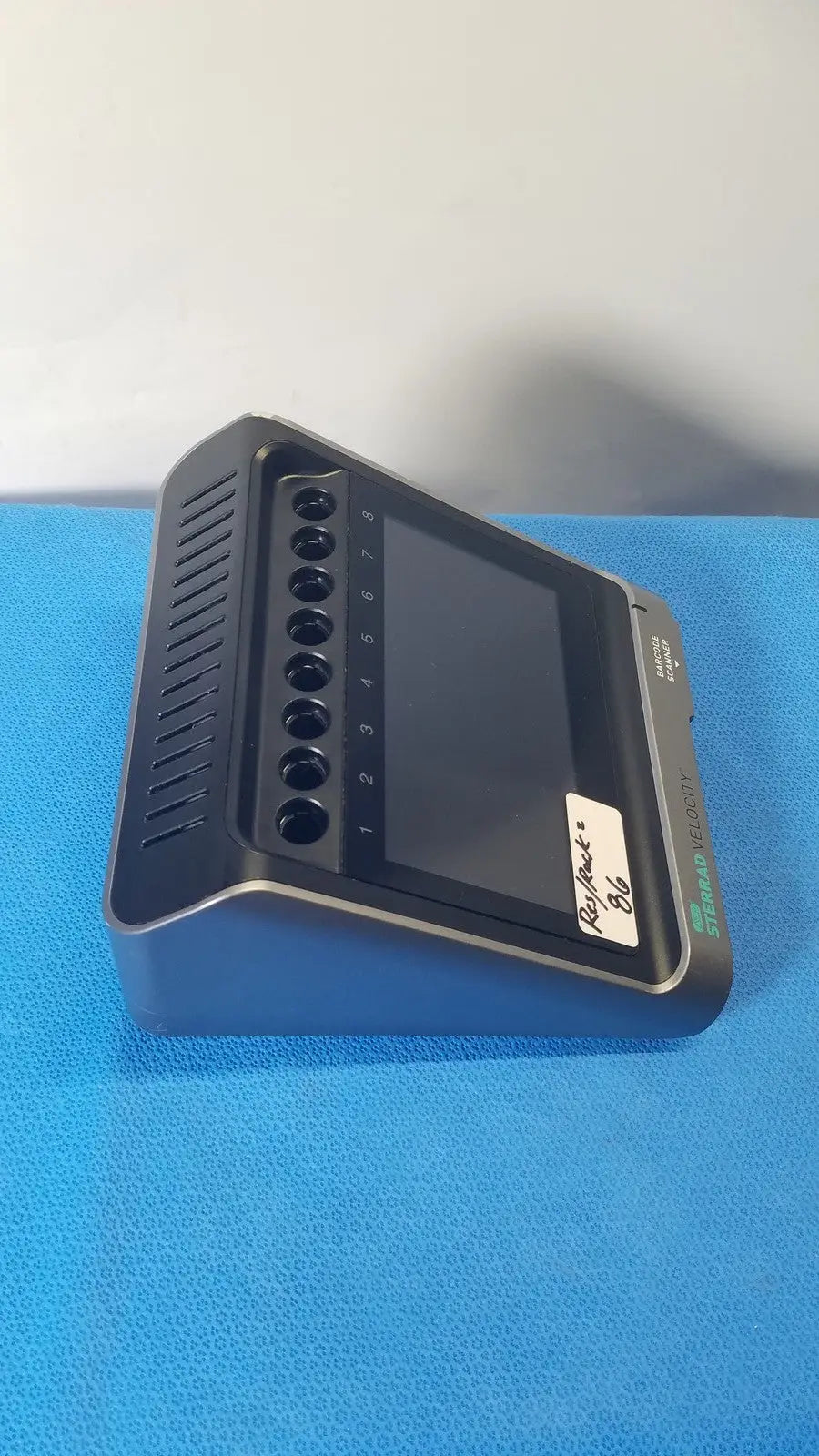 Black rectangular asp sterrad velocity barcode scanner reader with screen and numbered circular ports showing standard velocity logo