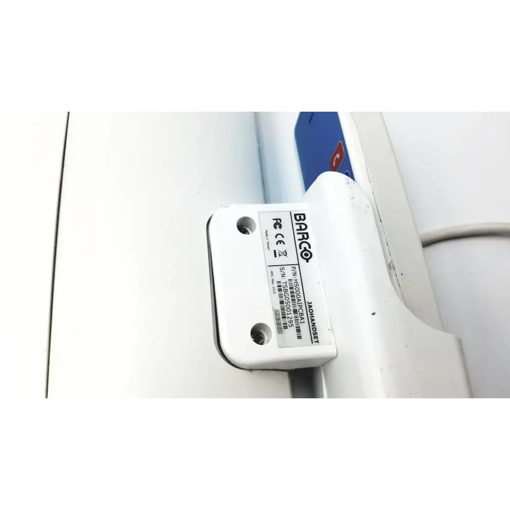 White plastic barco ja018 smart terminal electronic component label showing model and serial number for bedside multi-touch use