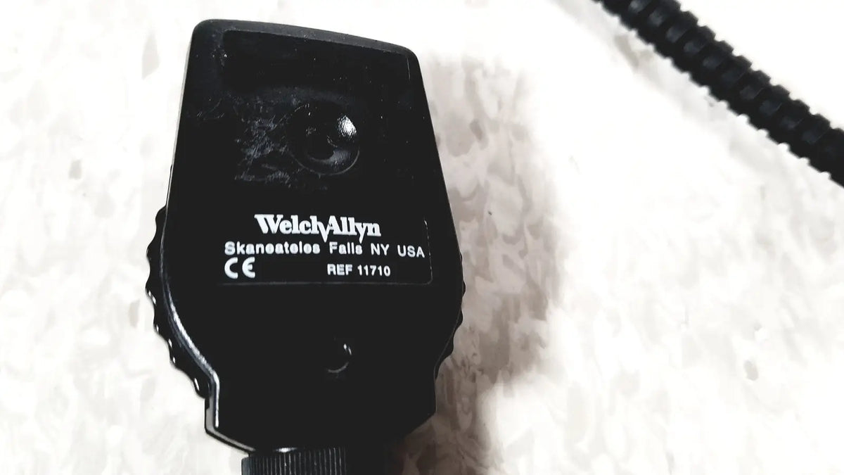 Beckman coulter airfuge ultracentrifuge 60hz 120v with a black welch allyn ophthalmoscope textured grip and coiled cable