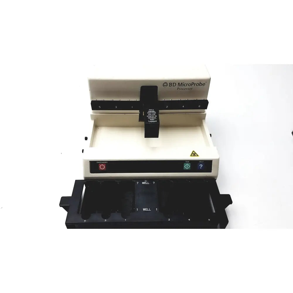 Beige Becton Dickinson 250100 microprobe processor with black components and labeled wells for laboratory equipment use