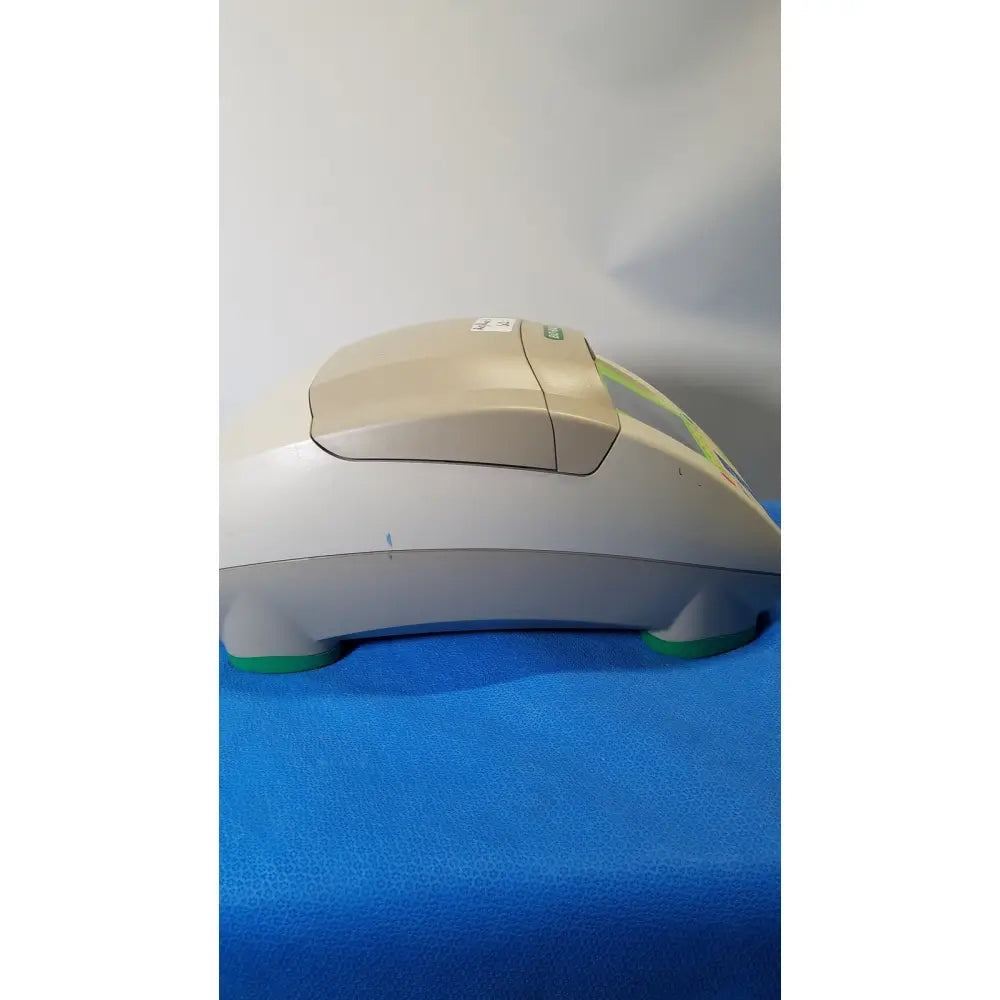 Beige and gray plastic bio-rad mycycler thermal cycler with green accents and sleek curved design for pcr applications