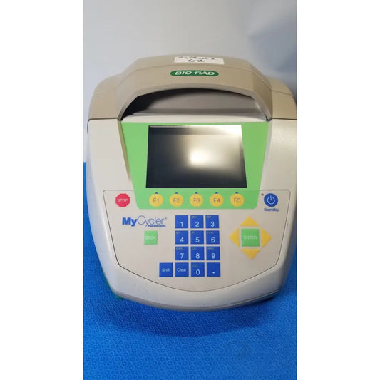 Beige and green bio-rad mycycler thermal cycler with digital display numeric keypad and power indicator for PCR use