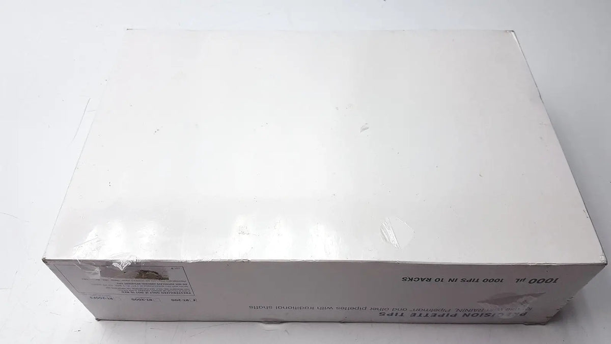 White cardboard box with bioclean precision pipette tips 1000ul in clear plastic wrap containing 1000 tips in 10 racks