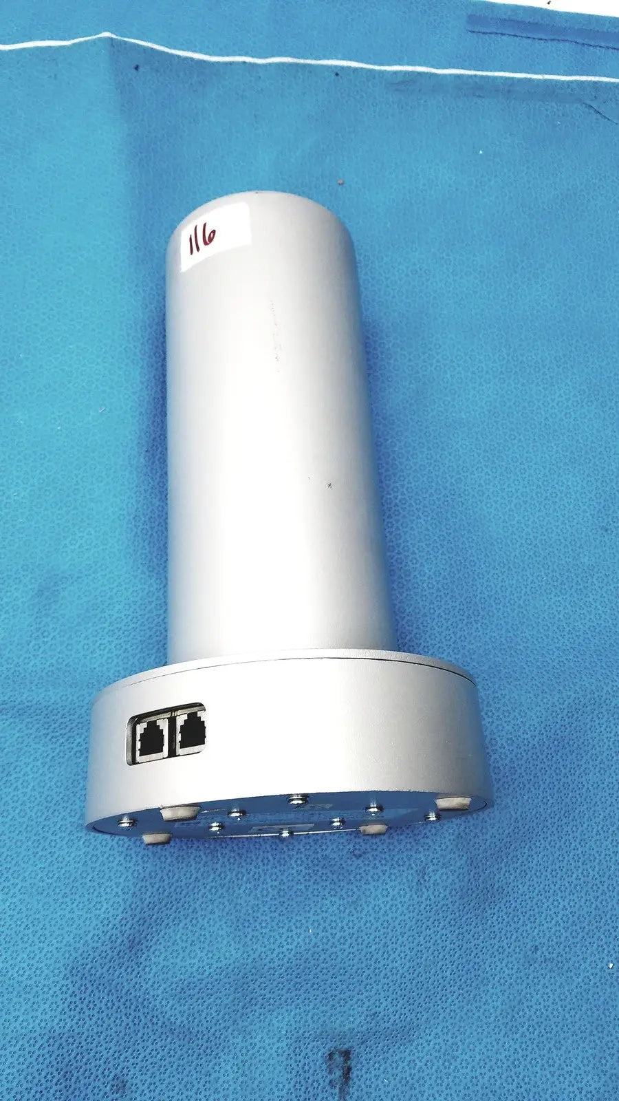 Silver cylindrical biodex medical systems wipe test counter with two ethernet ports and circular base with screws
