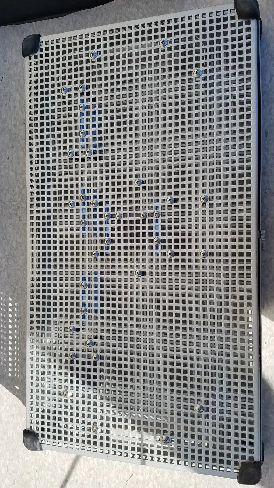 Silver metal grid sterilization tray with black corner protectors for summit medical ua2438 instrument use