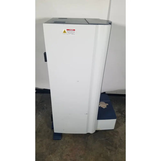 White and blue bruker microflex lt/sh mass spectrometer with warning label for reuse medical and laboratory analysis