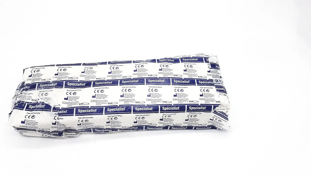 A neatly folded package of bsn medical specialist sterile gauze pads wrapped in white and blue printed paper for fast setting specialist plaster bandage use