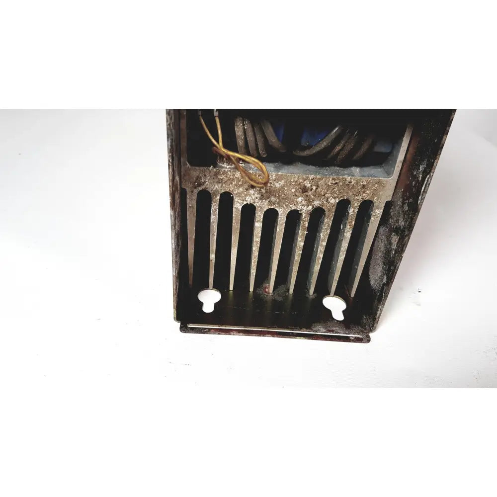 Rusty metal radiator with vertical slats and white plastic feet on the back side of bystronic amplifier cno2 25a product