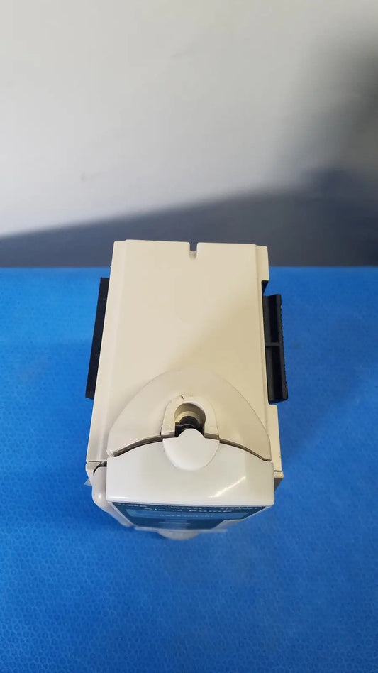 Beige plastic cardinal health alaris pump 8100 series device with black side clips and central circular opening